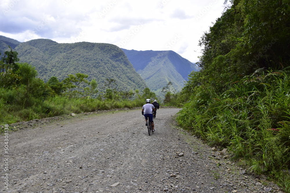 Fototapeta premium La Paz-Coroico, Bolivia - 29 January 2017: Cyclist on the Death road, Yungas North Road between La Paz and Coroico