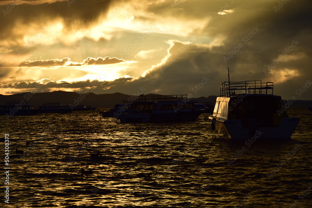 Sunset in a harbor of Copacabana town on Titicaca lake, Bolivia