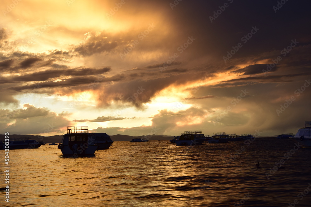 Sunset in a harbor of Copacabana town on Titicaca lake, Bolivia