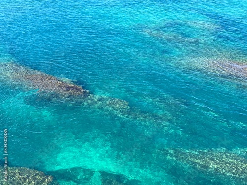 Sea turquoise blue water surface aerial view. Beautiful seascape. Harmony. Zen. Ocean.  © OLENA