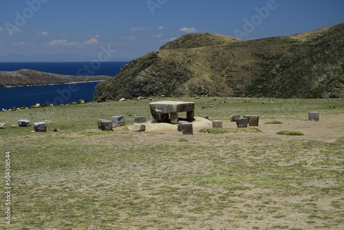 Inca prehistoric ruins on Island of Sun (Isla del Sol), Stone table sacrificial altar, ruins on the on Titicaca lake photo