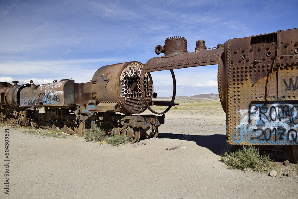 old rusty trains at the antique train cemetery close to the salt flats ...