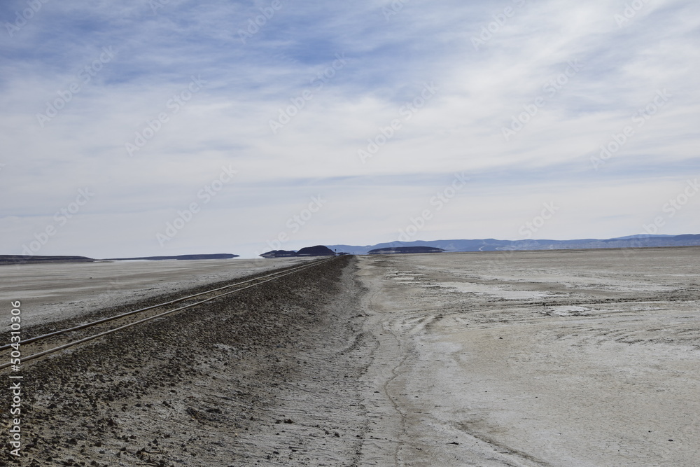 Railway rails on the territory of Salar de Uyuni, Bolivia Railway rails on the territory of Salar de Uyuni, Bolivia