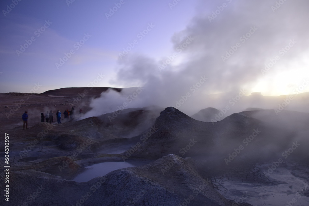 A geyser shoots out of the ground, a photo at dawn on a long exposure., on Eduardo Avaroa National Reserve in Uyuni