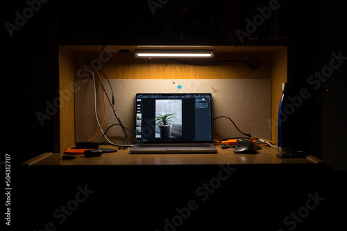 Computer Editing Photo in Dark Room