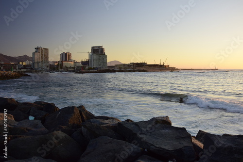 Sunset in the ocean, view from the embankment of Antofagasta, Chile.