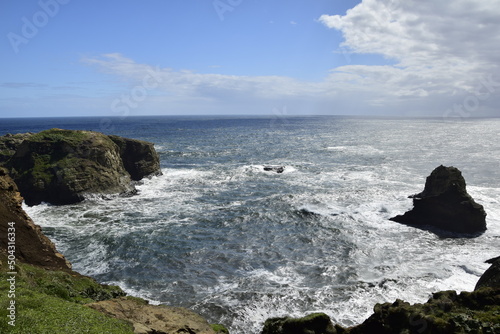 The landscape of the ocean and the rocky coast in Cucao on the way to Muelle de las Almas (Dock of Souls). Chiloe Island