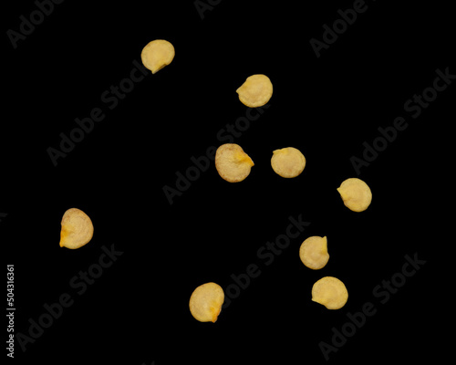 Pepper seeds isolated on black background.
