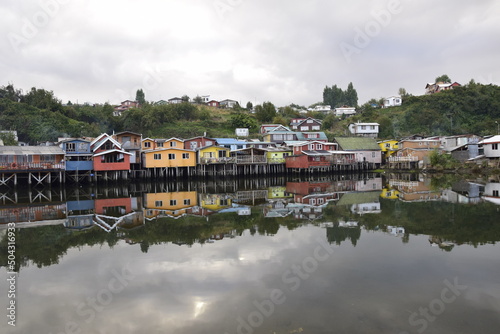 Houses on stilts (palafitos) reflected in the water in Castro, Chiloe Island, Patagonia, Chile