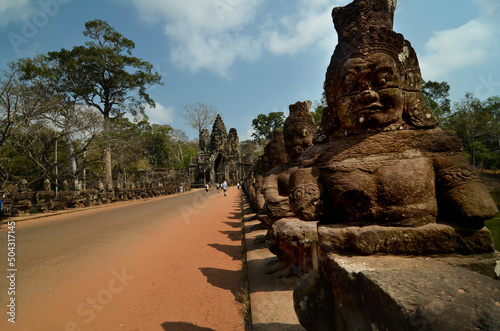 Tela Sculptures gods, spirits, demons and naga on a bridge in South gate of Angkor Thom