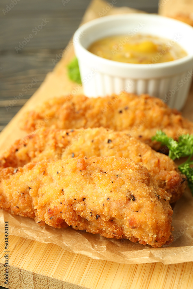 Concept of tasty food with chicken strips, close up Concept of tasty food with chicken strips, close up