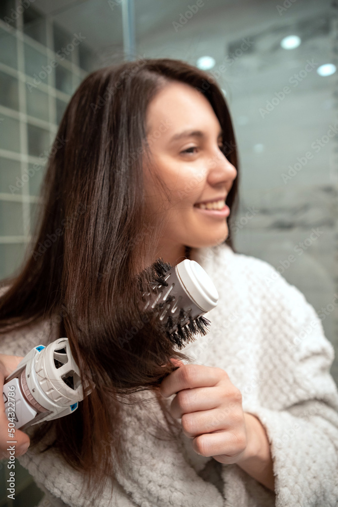 beautiful woman with hair dryer in front of mirror beautiful woman with hair dryer in front of mirror