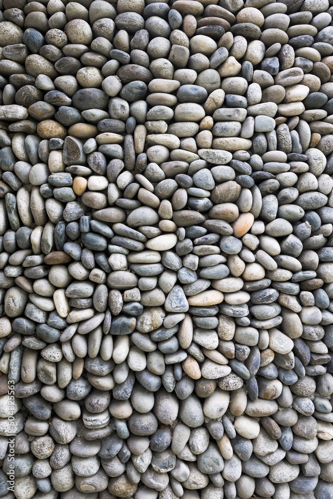 Vertical shot of cobblestones background . Close up view Vertical shot of cobblestones background . Close up view
