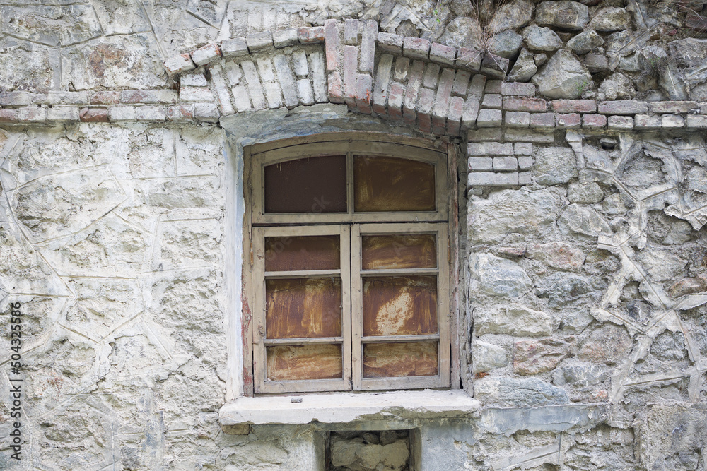 window of an abandoned building . close up view