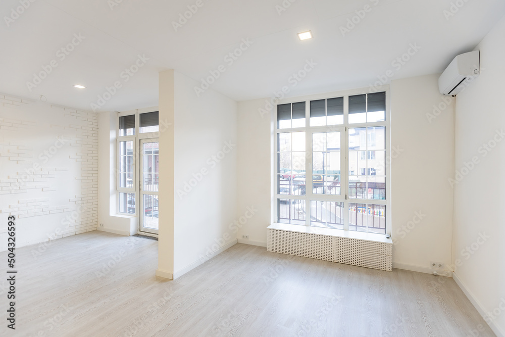 Fototapeta premium Modern empty elegant office with windows and workplaces.