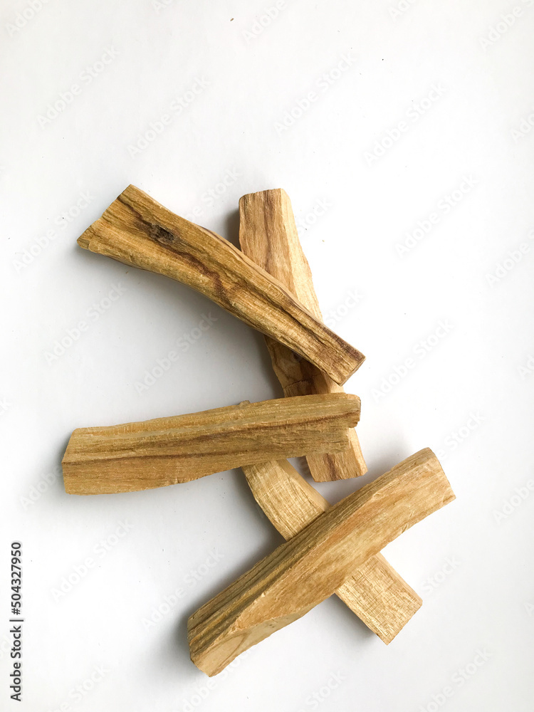 Set of wooden palo santo aroma sticks, natural incense top view, place for text