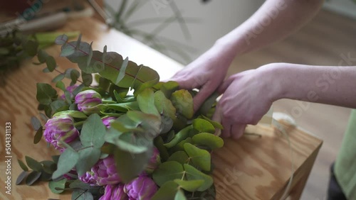 Bouquet of flowers close-up. Creating a floral arrangement on the florist's table. Small business