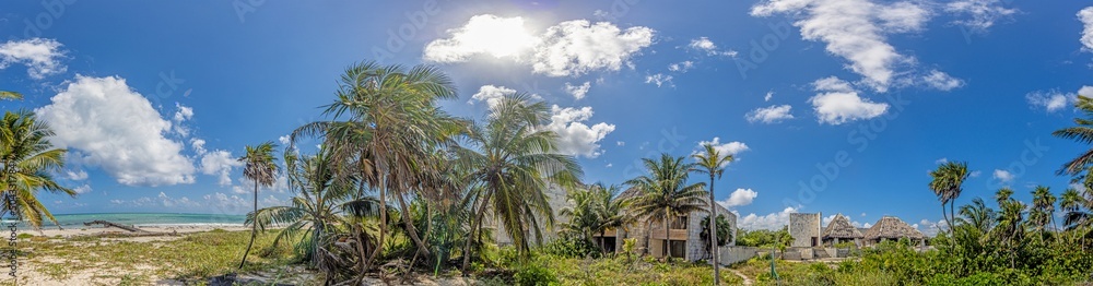 Picture of a destroyed, overgrown and left to itself hotel complex on a beach Picture of a destroyed, overgrown and left to itself hotel complex on a beach