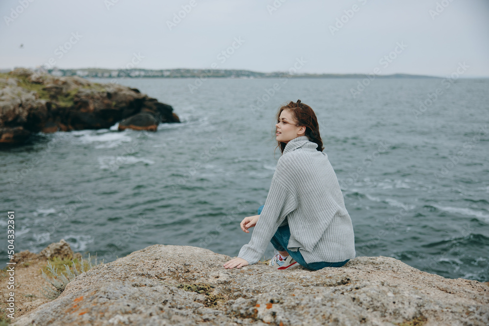 beautiful woman long hair nature rocks coast landscape female relaxing