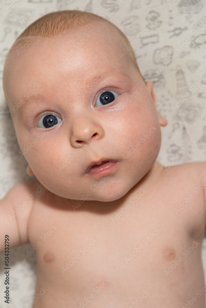 close-up portrait of a three-month-old baby with blue eyes close-up portrait of a three-month-old baby with blue eyes