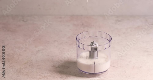 Adding milk in blender smoothy preparation