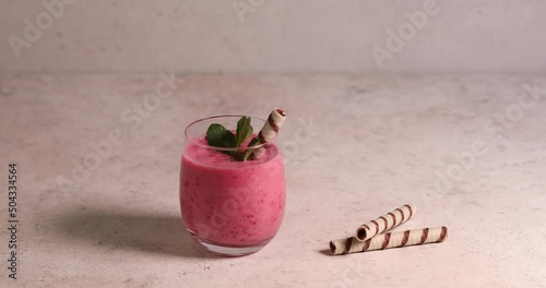 Raspberry smoothie in glass jar. Healthy refreshed homemade beverage.