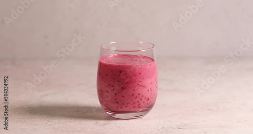 Raspberry smoothie in glass jar. Healthy refreshed homemade beverage.