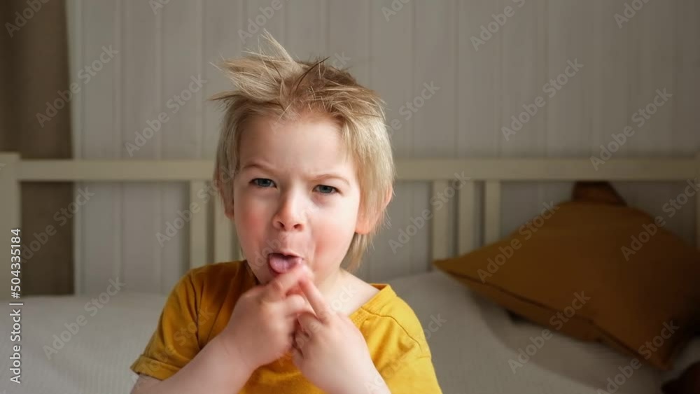 Boy joking, sticking tongue out with silly expression. Child making face. Funny foolishness portrait of little baby boy on white background. Adorable caucasian kid making crazy and comical gesture. Boy joking, sticking tongue out with silly expression. Child making face. Funny foolishness portrait of little baby boy on white background. Adorable caucasian kid making crazy and comical gesture.
