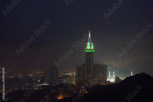 Skyline with Abraj Al Bait (Royal Clock Tower Makkah) in Makkah, Saudi Arabia. The tower is the tallest clock tower in the world at 601m (1972 feet). photo