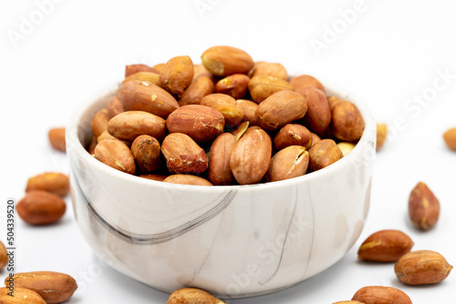 Peanuts on a white background. Healthy and fresh.nuts. Close-up.