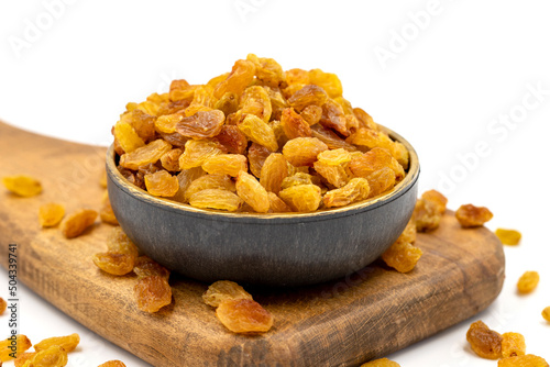 Dried raisins on a white background. Healthy and fresh.nuts. Close-up.