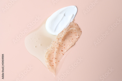 Various cosmetic creams on pastel background. Background of cosmetic products strokes