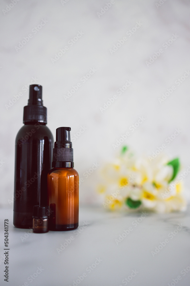 natural beauty and organic ingredients in skincare, apothecary skincare bottles with tropical flowers bokeh natural beauty and organic ingredients in skincare, apothecary skincare bottles with tropical flowers bokeh