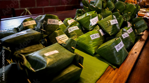 "Nasi Bakar" or Grilled rice which is a menu at "angkringan" or street food in Java. with a characteristic with banana leaf wrap