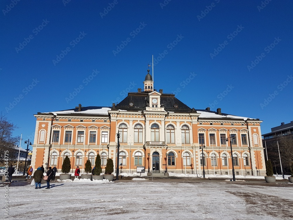 Kuopio city hall and market square at winter with clear blue sky.