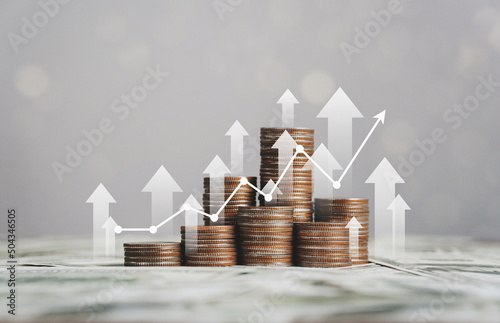 stack of silver coins with trading chart in financial concepts and financial investment business stock growth photo