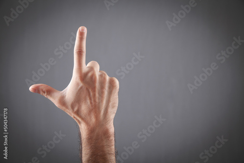 Vászonkép Male hand making Loser gesture. Space for your text