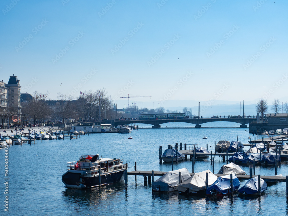 Zurich, Switzerland - March 5th 2022: View along Limmat river towards Bellevue bridge