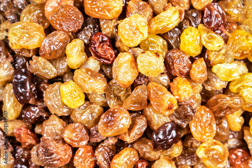 background of delicious sweet yellow raisins on the table close-up