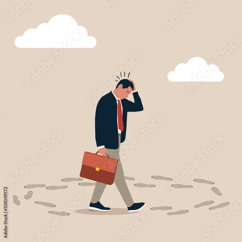 Frustrated businessman walk in circle with no way out and no career path. Career path dead end, work on same old repetitive job, business as usual no motivation or infinity loop routine job concept. photo