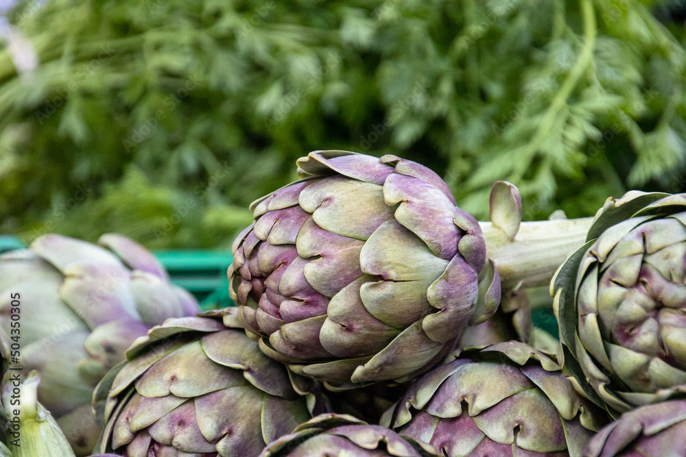 Obraz premium close up of raw artichoke in a market