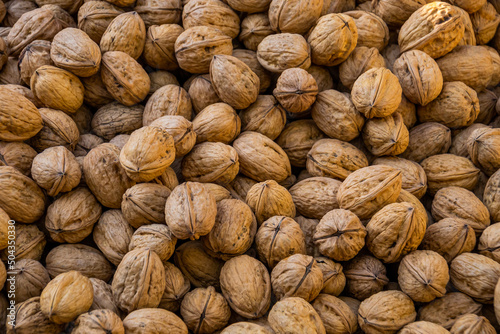 close up of a pile of fresh walnuts