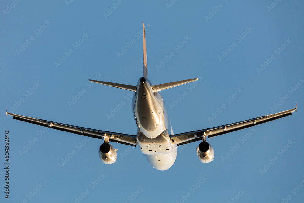 Commercial Airliner aircraft flying against a clear blue sky. Commercial Airliner aircraft flying against a clear blue sky.