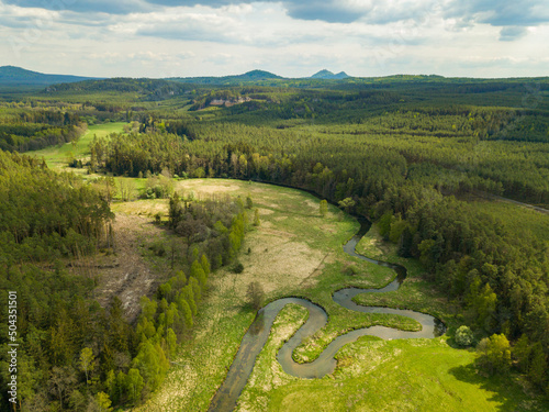 Meandering and twisting river. View from above. Ploucnice river Czech Republic photo