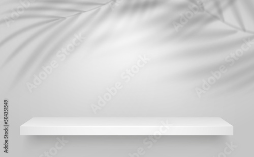 White shelf with shadow overlay of palm leaf silhouette on grey background. Sunlight effect for summer poster. Vector mockup template