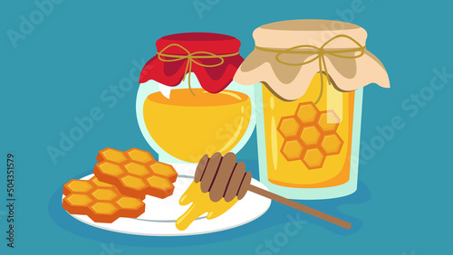 a jar of honey and honeycombs on the table