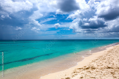 Travel background with clouds sky and Caribbean sea. © Swetlana Wall