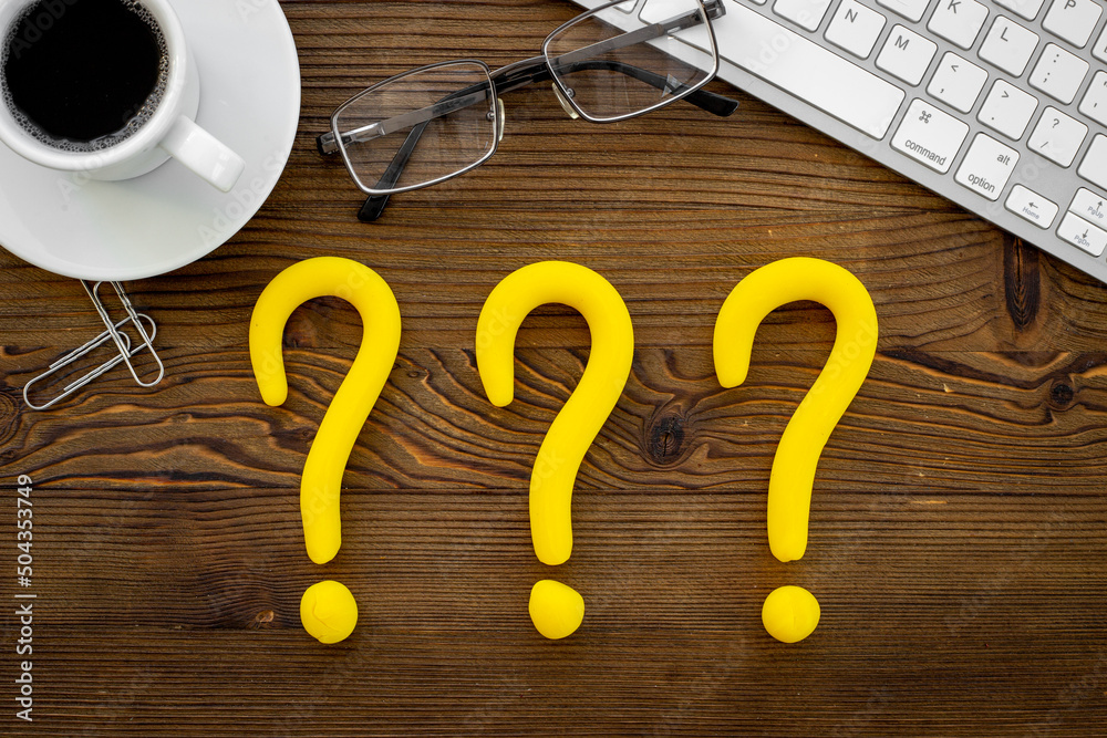 Question mark symbol on office desk. Solving problem or search solution concept Question mark symbol on office desk. Solving problem or search solution concept