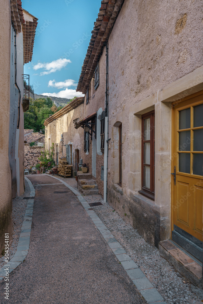 Historical buildings and street in an ancient town Mourèze, in Herault, in Occitanie, France Historical buildings and street in an ancient town Mourèze, in Herault, in Occitanie, France