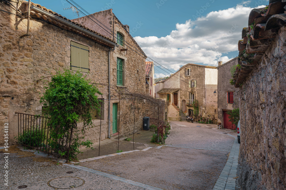Historical buildings and street in an ancient town Mourèze, in Herault, in Occitanie, France